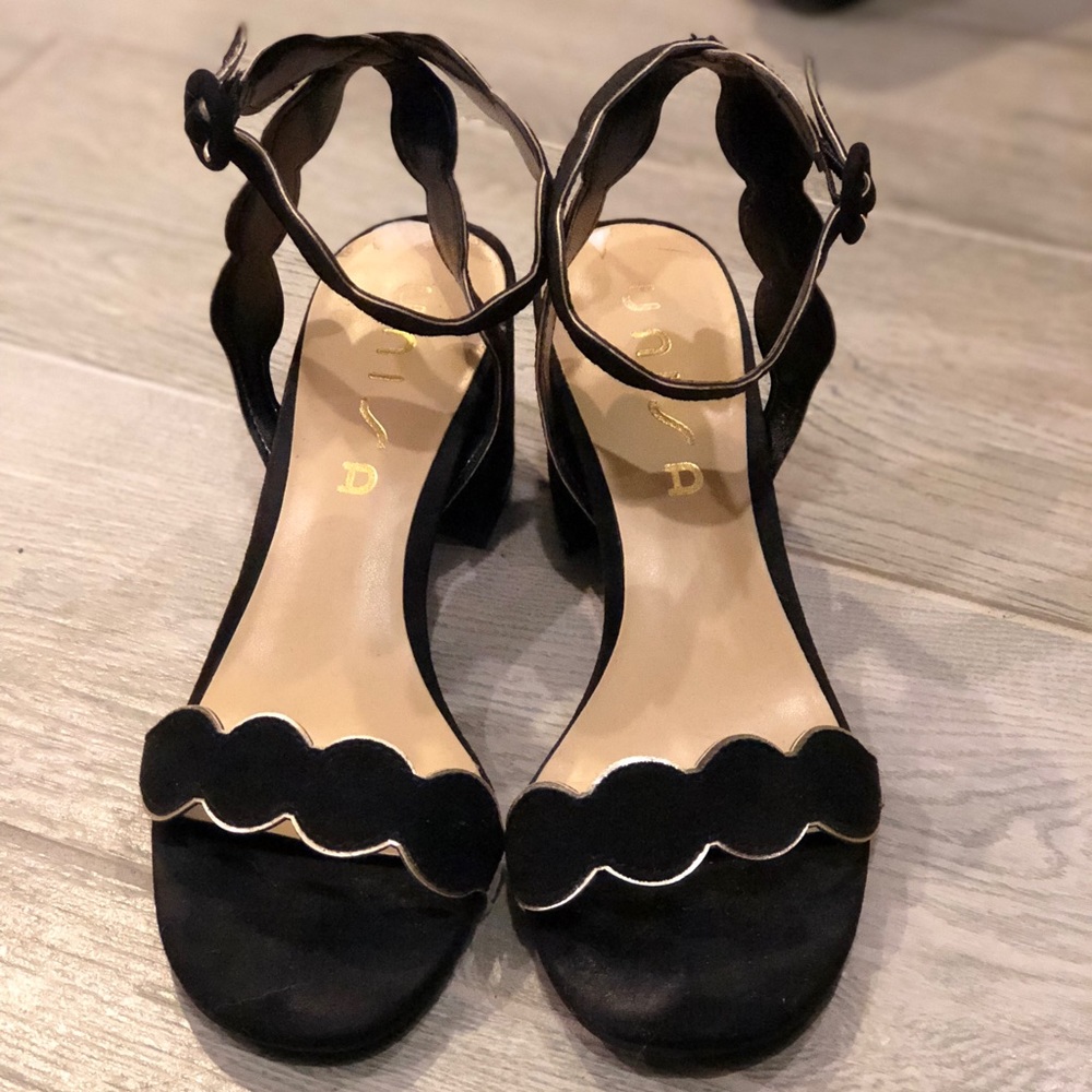 Black heels with gold embellishment